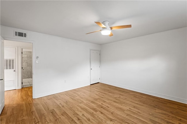 empty room featuring light hardwood / wood-style flooring and ceiling fan