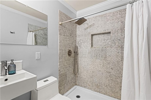 bathroom with ornamental molding, sink, a shower with shower curtain, and toilet