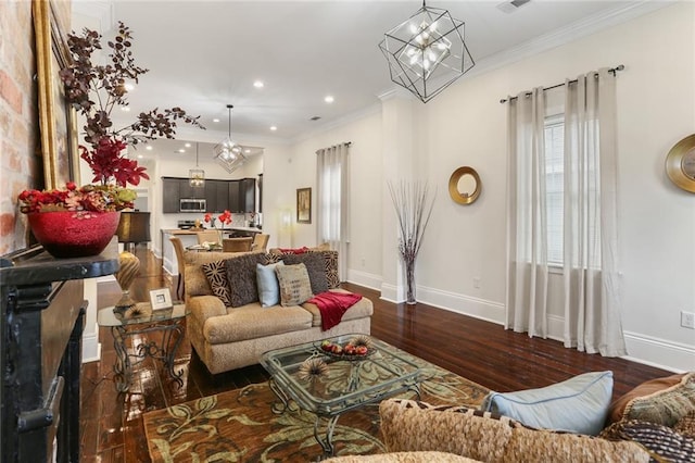 2835 Danneel St, New Orleans, LA 70115 - living room featuring dark wood-style flooring, baseboards, ornamental molding, recessed lighting, and a chandelier