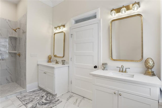 2835 Danneel St, New Orleans, LA 70115 - bathroom with marble look tiles, a tile shower, and two vanities
