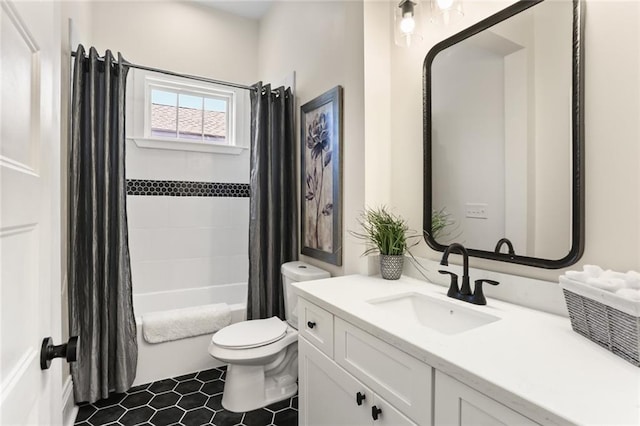 full bathroom with vanity, tile patterned floors, toilet, and shower / tub combo