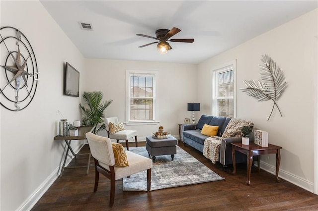 2835 Danneel St, New Orleans, LA 70115 - living area featuring healthy amount of natural light, wood finished floors, baseboards, and a ceiling fan