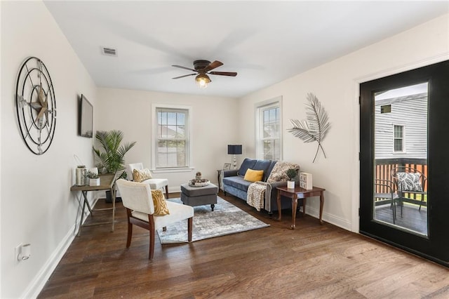 living room featuring ceiling fan and wood-type flooring