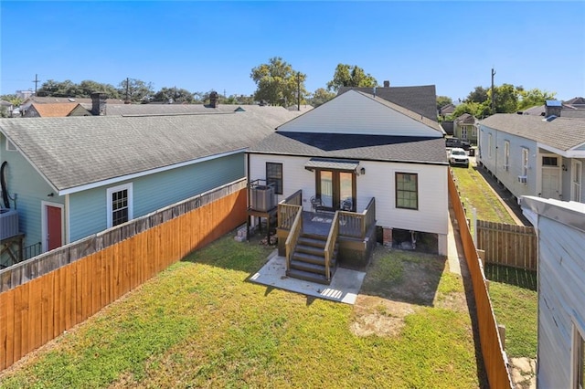 2835 Danneel St, New Orleans, LA 70115 - rear view of property featuring a wooden deck and a shingled roof