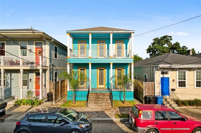 view of front facade featuring a porch and a balcony