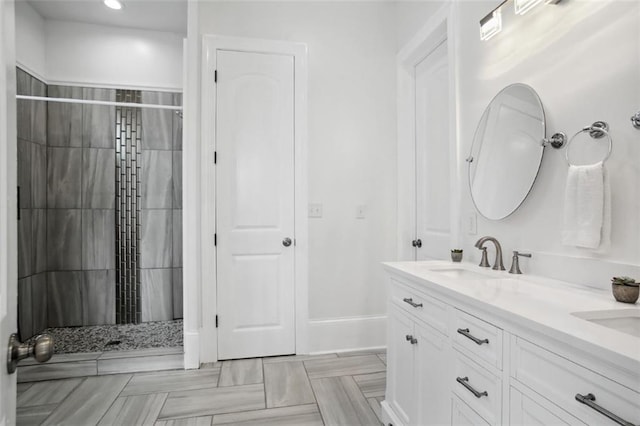 bathroom with vanity and a shower