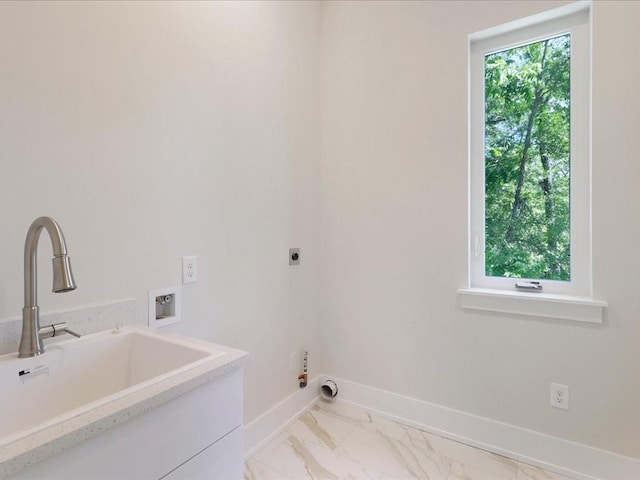 laundry room with laundry area, baseboards, a sink, marble finish floor, and electric dryer hookup