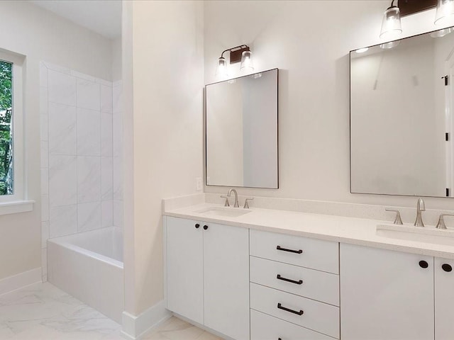 bathroom featuring vanity and tub / shower combination