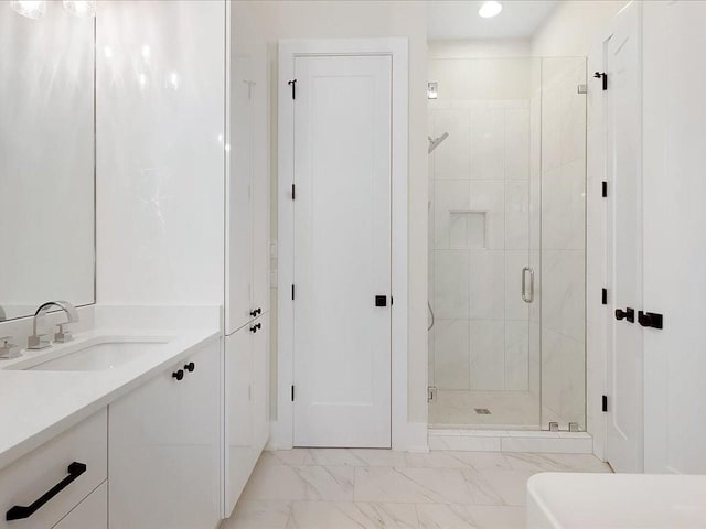 full bath featuring a stall shower, marble finish floor, vanity, and recessed lighting