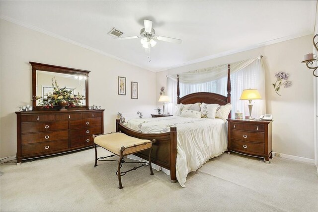 carpeted bedroom featuring crown molding and ceiling fan