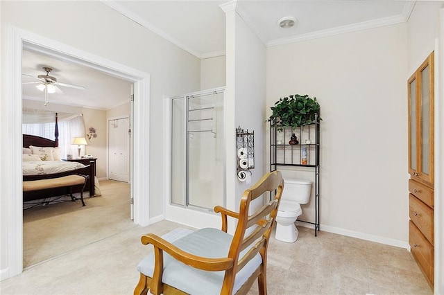 living area featuring ornamental molding and ceiling fan