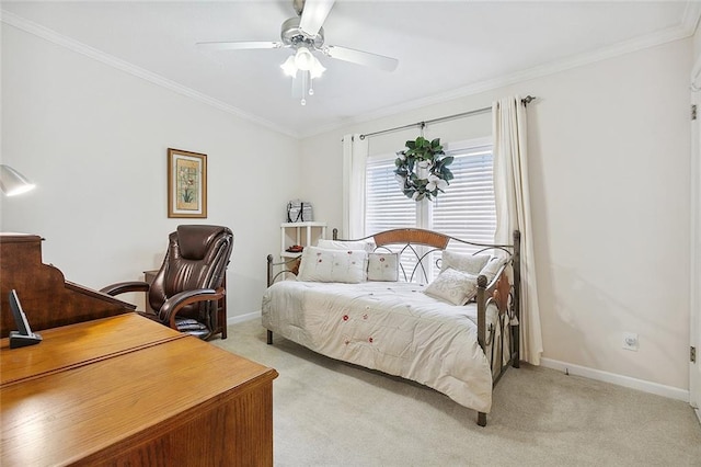 carpeted bedroom with ornamental molding and ceiling fan