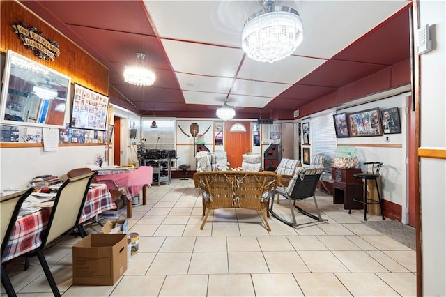 tiled dining area with a notable chandelier