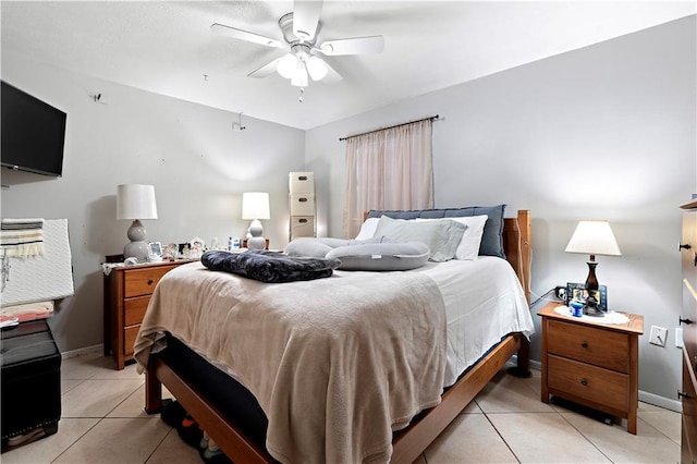 bedroom featuring light tile patterned flooring and ceiling fan