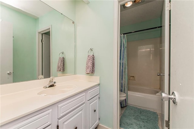 full bathroom with vanity, toilet, and shower / bath combo with shower curtain