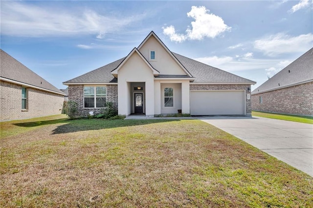 view of front of house featuring a garage and a front yard