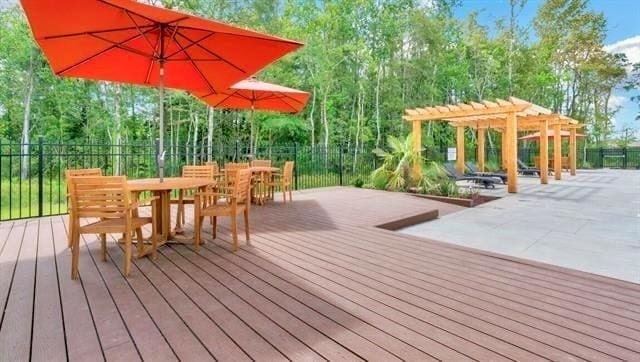 wooden deck featuring a pergola