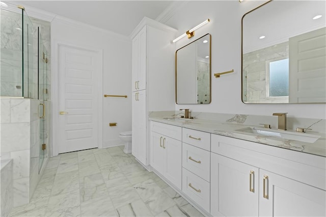 bathroom featuring vanity, ornamental molding, toilet, and walk in shower