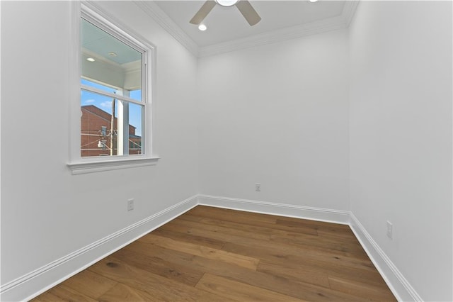 empty room featuring ornamental molding, hardwood / wood-style flooring, and ceiling fan