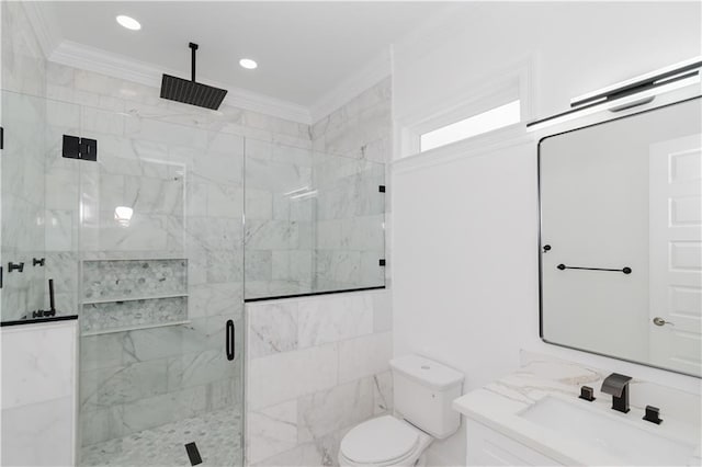 bathroom with vanity, ornamental molding, toilet, and walk in shower