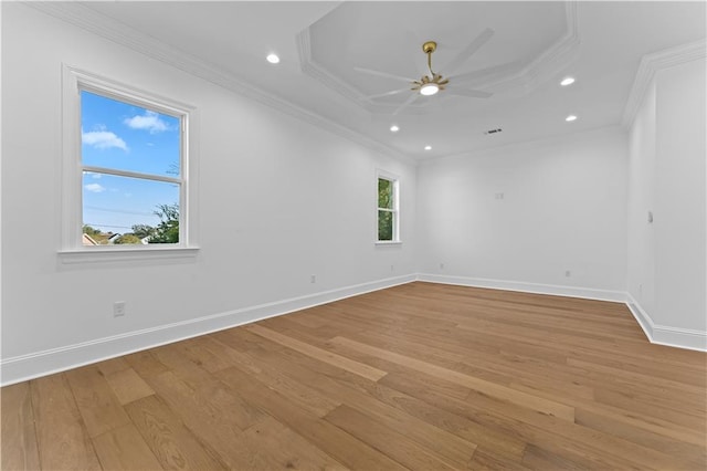 unfurnished room featuring crown molding, light hardwood / wood-style floors, and ceiling fan