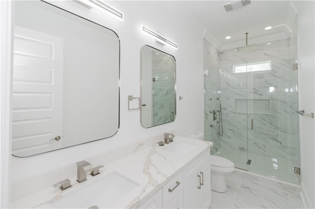 bathroom featuring vanity, toilet, and a shower with shower door