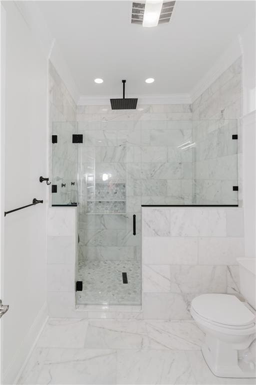 bathroom with toilet, an enclosed shower, and crown molding