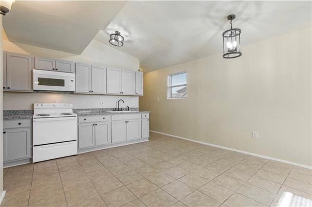 kitchen featuring white appliances, sink, vaulted ceiling, pendant lighting, and gray cabinets