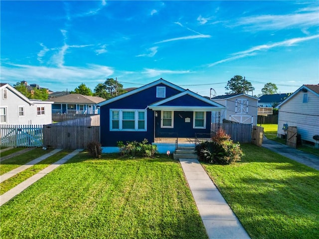 bungalow-style home featuring a front yard