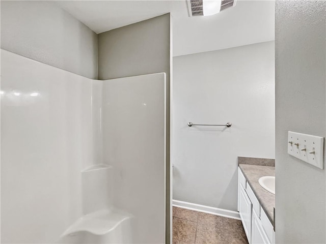 bathroom with vanity and tile patterned flooring