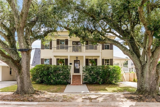 view of front of house featuring a balcony