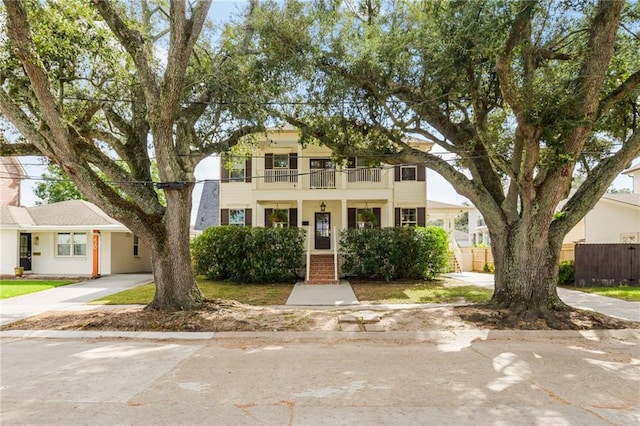 view of front of property with a balcony