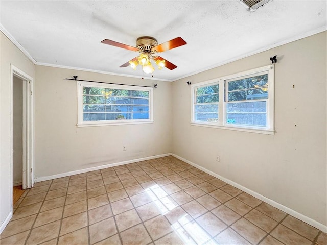 spare room featuring crown molding, a healthy amount of sunlight, and ceiling fan