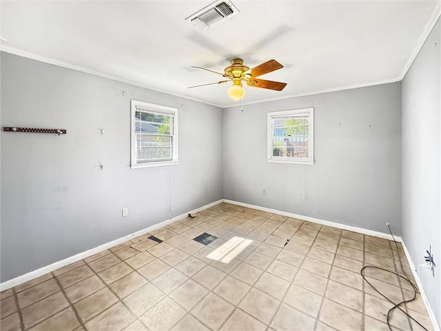 spare room with ornamental molding and ceiling fan