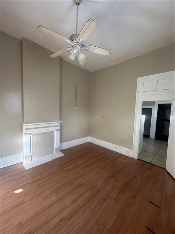 interior space with hardwood / wood-style floors and ceiling fan