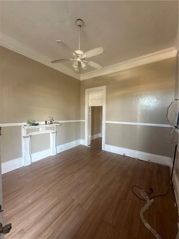 spare room featuring crown molding, hardwood / wood-style flooring, and ceiling fan