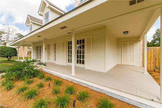 view of exterior entry featuring a patio area