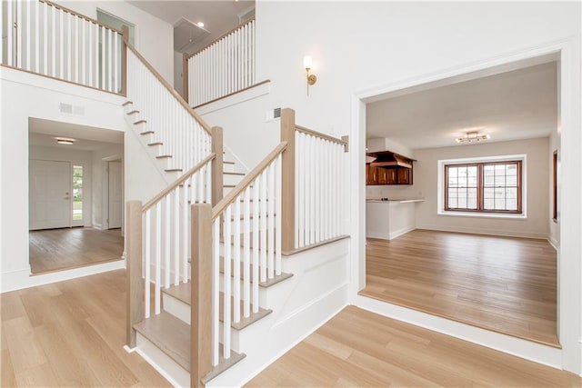 stairs with hardwood / wood-style flooring