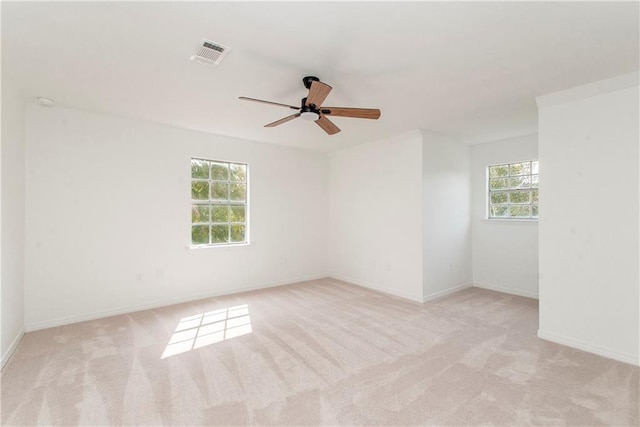 carpeted empty room with ceiling fan