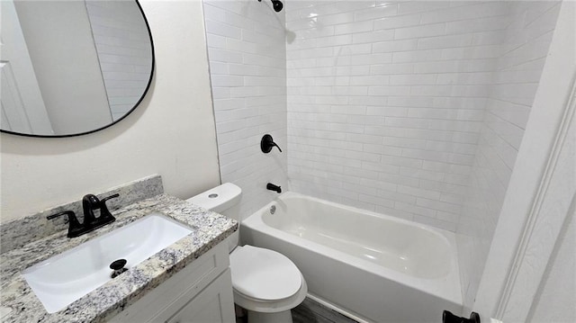 full bathroom featuring bathing tub / shower combination, vanity, and toilet