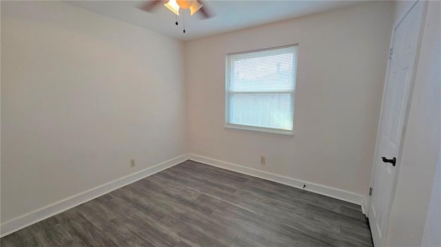 empty room featuring ceiling fan and dark wood-type flooring