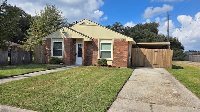 view of front facade featuring a front lawn and a carport