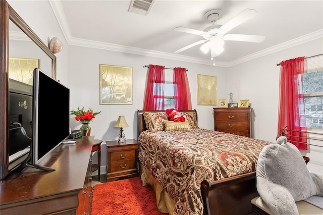 bedroom featuring crown molding, multiple windows, and ceiling fan