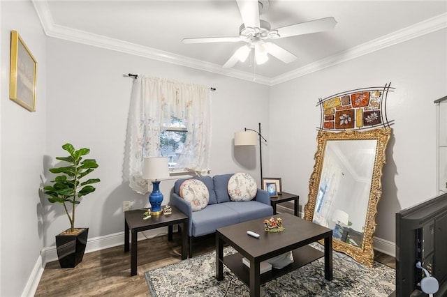 sitting room featuring ornamental molding, wood-type flooring, and ceiling fan