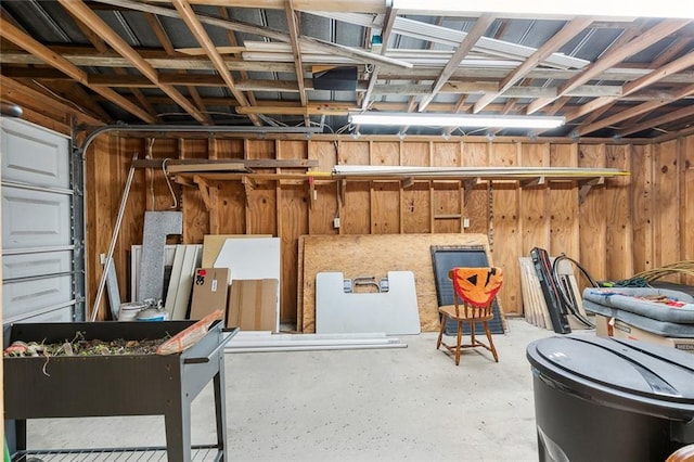 garage featuring wooden walls