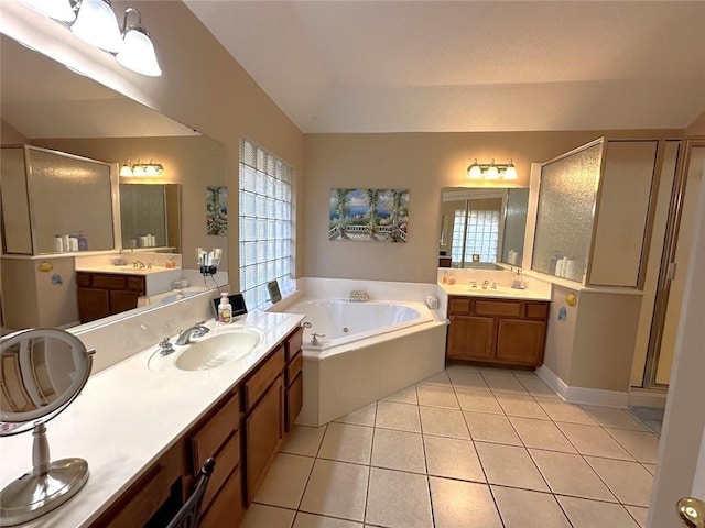 bathroom with plus walk in shower, vanity, and tile patterned floors