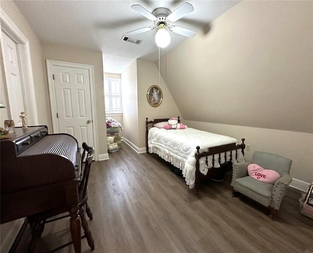 bedroom featuring a textured ceiling, dark wood-type flooring, ceiling fan, and lofted ceiling