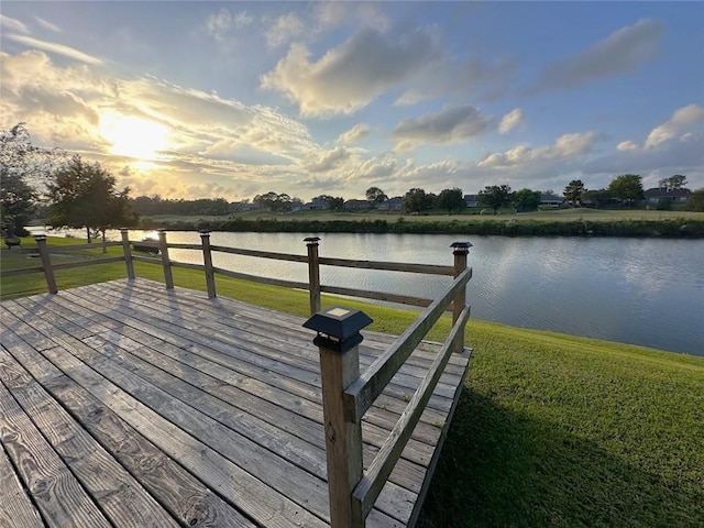 exterior space featuring a water view and a yard