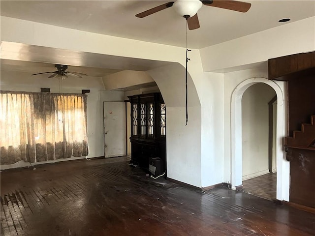 interior space with dark hardwood / wood-style floors and ceiling fan