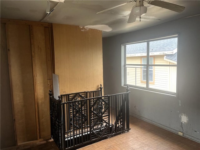 bedroom featuring ceiling fan and light parquet flooring